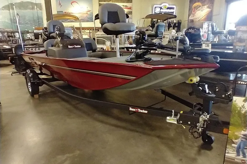 Slide: The Image of 2026 Tracker Bass Tracker Classic XL boat displayed in showroom, featuring sleek red design. - 4