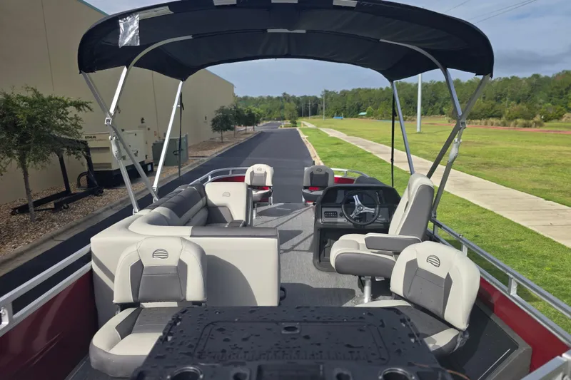 Slide: The Image of 2026 Sun Tracker SportFish 20 DLX pontoon boat with spacious seating and canopy. - 56