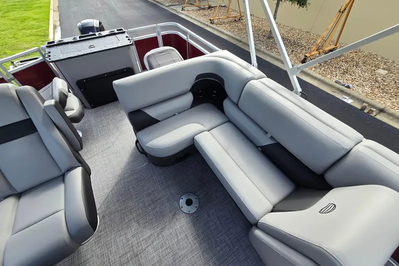 Slide: The Image of 2026 Sun Tracker SportFish 20 DLX interior with gray seating and spacious layout. - 54