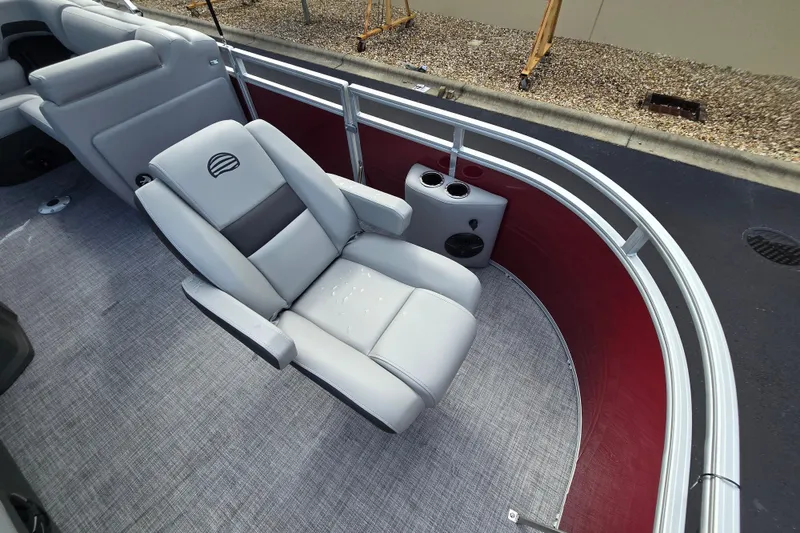 Slide: The Image of 2026 Sun Tracker SportFish 20 DLX boat interior with gray seating and red paneling. - 55