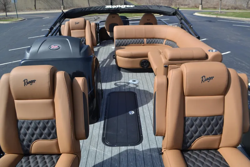Slide: The Image of 2026 Ranger 223F boat interior with tan and black seating, showcasing luxury design. - 70