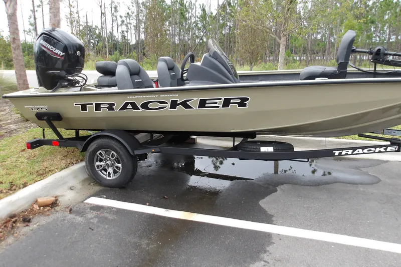 The Image of 2026 Tracker Pro Team 175 boat on trailer in parking lot. - 1