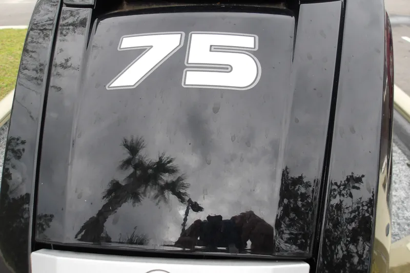 Slide: The Image of Close-up of 2026 Tracker Pro Team 175 engine with '75' decal. - 18