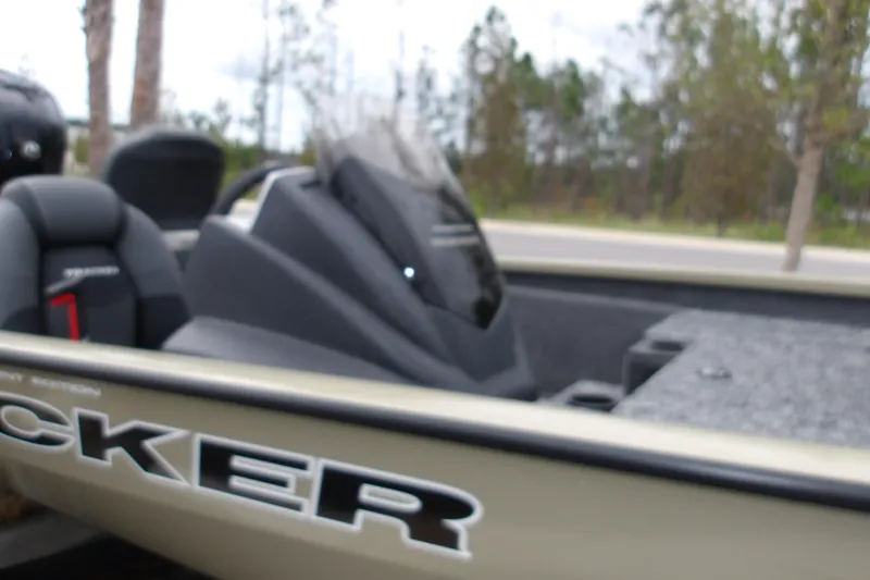 Slide: The Image of 2026 Tracker Pro Team 175 boat interior with seats and console, outdoors. - 15