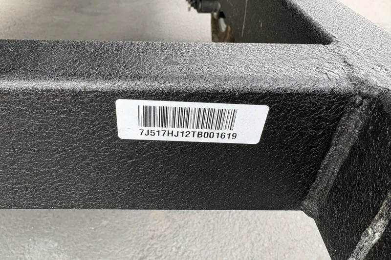 Slide: The Image of Barcode label on Tracker Grizzly 1860 Utility 2026 model frame. - 28