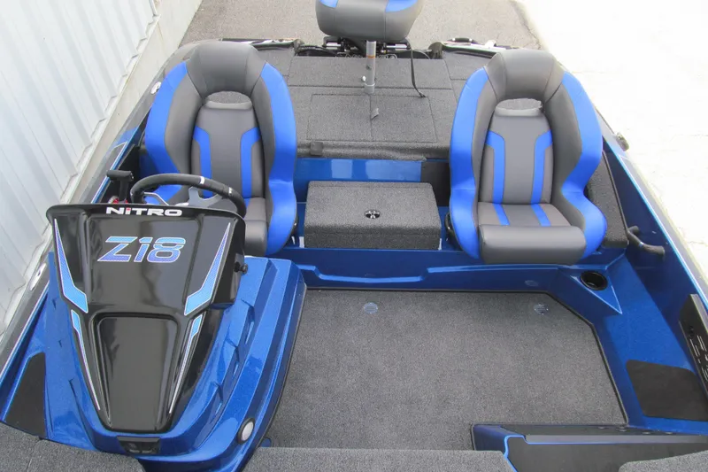 Slide: The Image of 2026 Nitro Z18 Pro boat interior with blue and gray seats, steering console. - 102