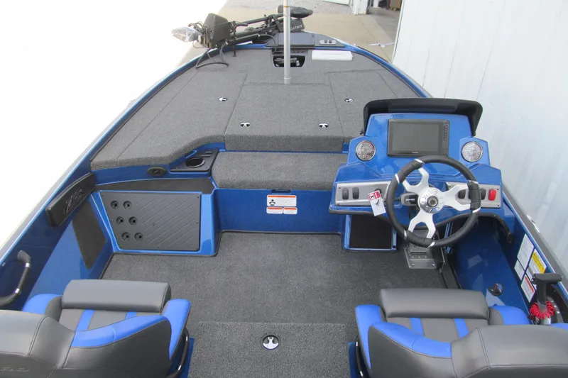 Slide: The Image of Interior view of a 2026 Nitro Z18 Pro boat, featuring a sleek blue design and modern dashboard. - 96