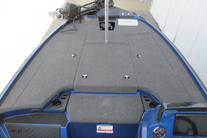 Slide: The Image of 2026 Nitro Z18 Pro boat deck with carpeted surface and fishing equipment. - 98