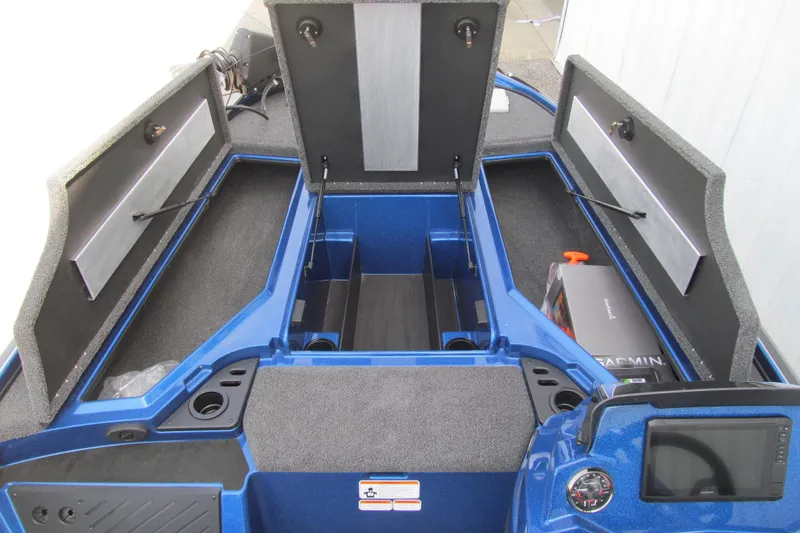 Slide: The Image of 2026 Nitro Z18 Pro boat interior with open storage compartments and Garmin equipment. - 99
