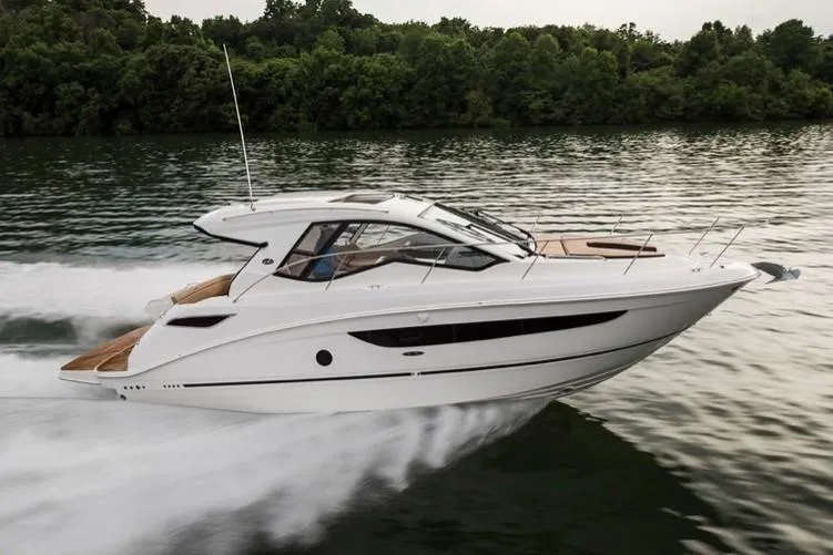 Slide: The Image of Manufacturer Provided Image: 2021 Sea Ray Sundancer 350 Coupe cruising on a lake. - 10