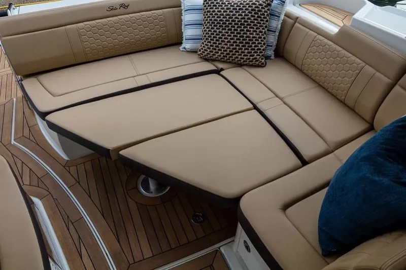Slide: The Image of Manufacturer Provided Image: Luxurious seating area on 2021 Sea Ray Sundancer 350 Coupe with plush cushions and pillows. - 19