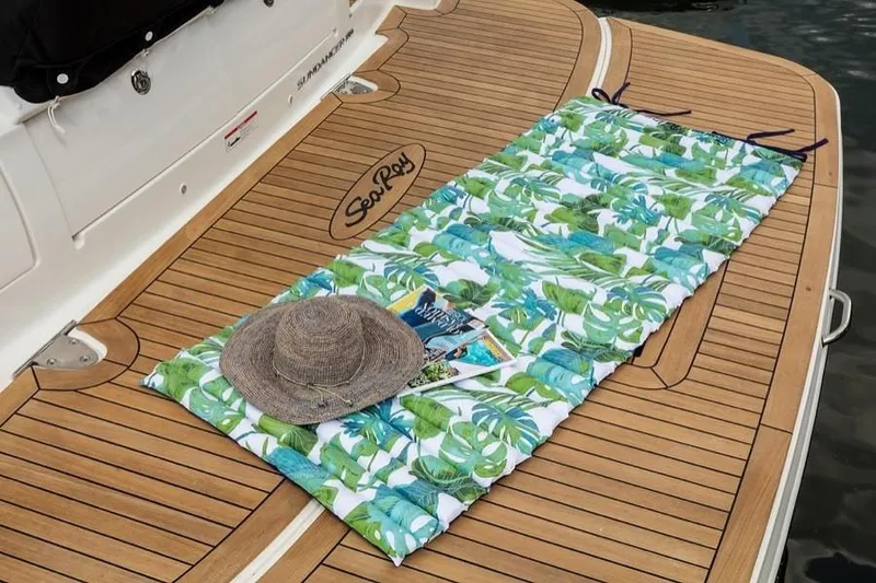 Slide: The Image of Manufacturer Provided Image: Sea Ray Sundancer 350 Coupe 2021 with a tropical mat and hat on the deck. - 20