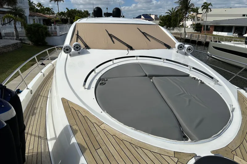 Slide: The Image of 2009 Lazzara LSX 75 yacht deck with sunbathing area and sleek design. - 16