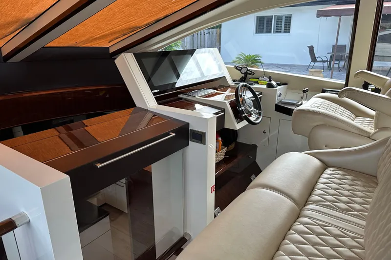 Slide: The Image of Luxurious interior of a 2009 Lazzara LSX 75 yacht with leather seating and modern controls. - 23