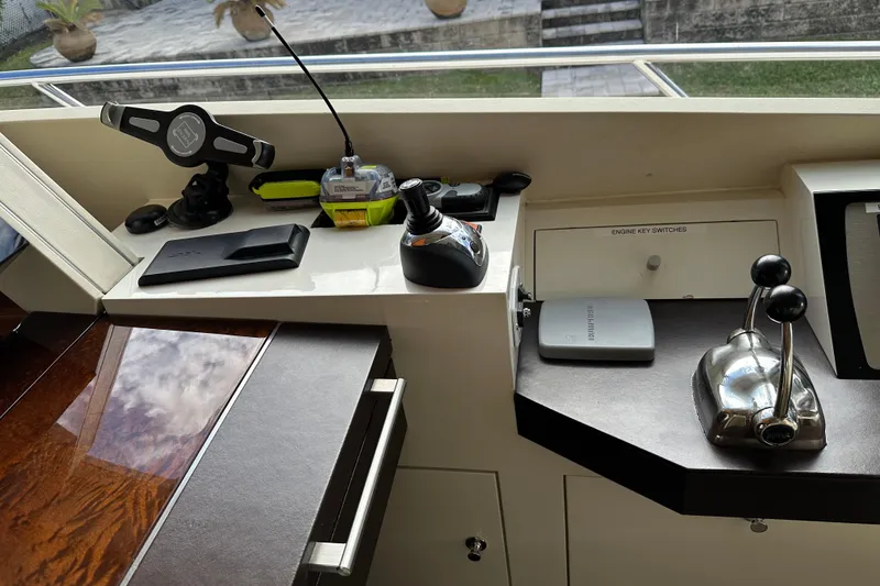 Slide: The Image of Control panel of 2009 Lazzara LSX 75 yacht with joystick and throttle levers. - 25