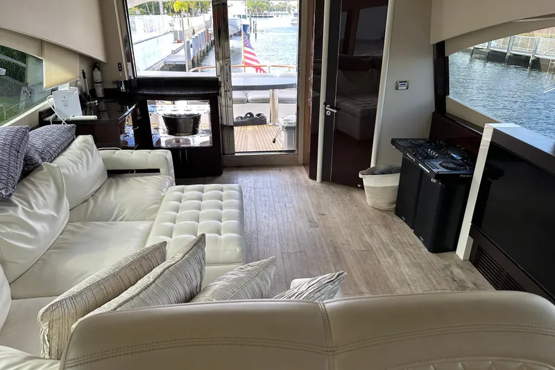 Slide: The Image of Luxurious interior of 2009 Lazzara LSX 75 yacht with plush seating and waterfront view. - 26