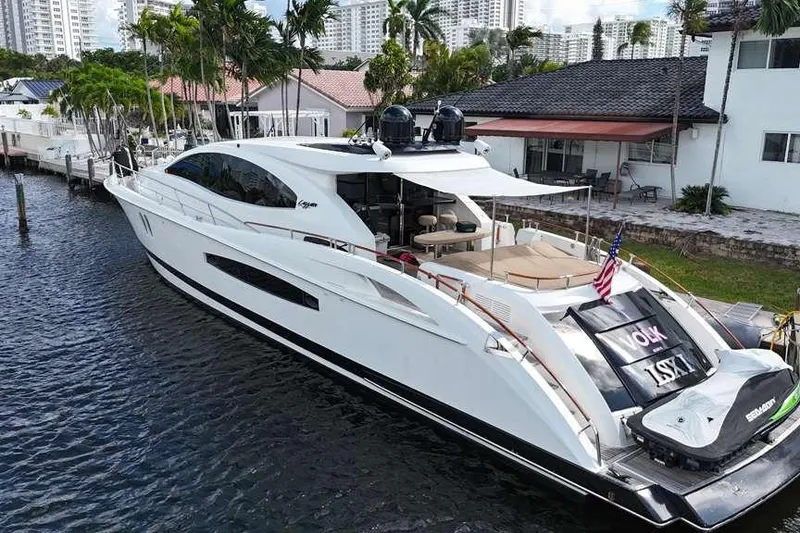 Slide: The Image of Luxury 2009 Lazzara LSX 75 yacht docked by waterfront homes. - 3