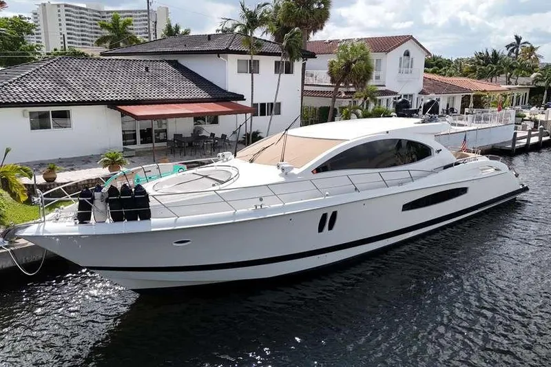 Slide: The Image of Luxury 2009 Lazzara LSX 75 yacht docked by waterfront homes. - 4