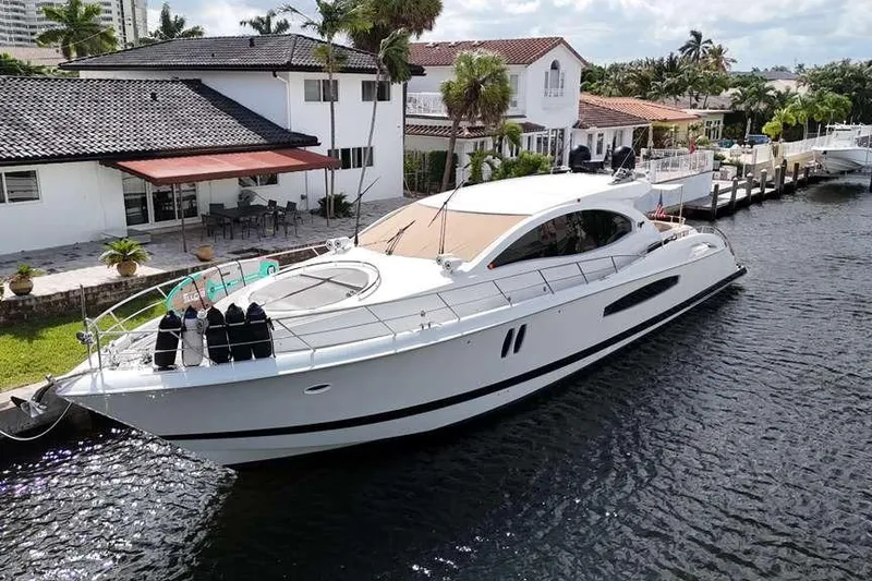 Slide: The Image of 2009 Lazzara LSX 75 yacht docked by waterfront homes. - 8