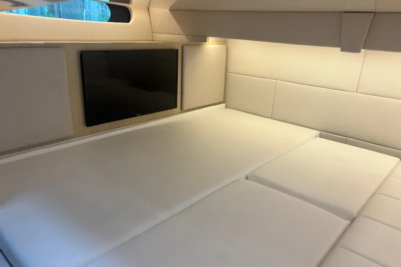 Slide: The Image of Luxurious interior cabin of 2024 Regal 36 XO yacht with TV and plush seating. - 30
