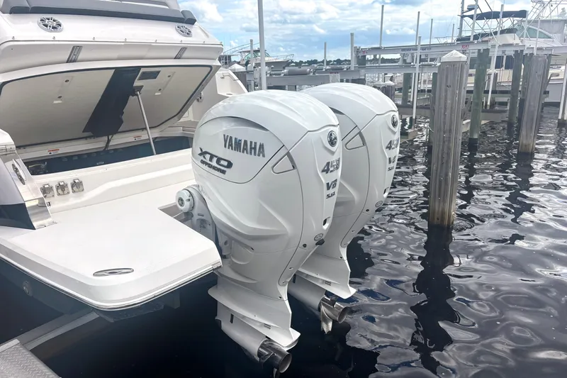 Slide: The Image of 2024 Regal 36 XO boat with twin Yamaha XTO 425 V8 outboard engines at dock. - 9