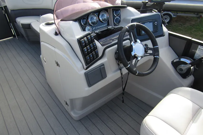 Slide: The Image of 2022 Starcraft SLS 5 boat dashboard with steering wheel and control panel. - 12