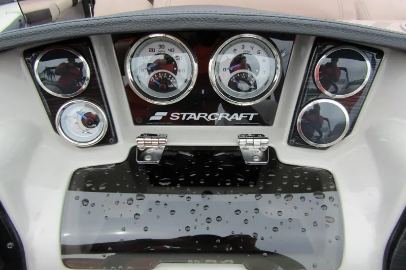 Slide: The Image of Dashboard of 2022 Starcraft SLS 5 boat with gauges and logo. - 14