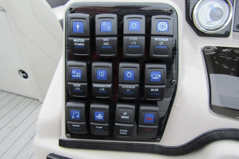 Slide: The Image of Control panel of 2022 Starcraft SLS 5 boat with labeled switches and gauge. - 15