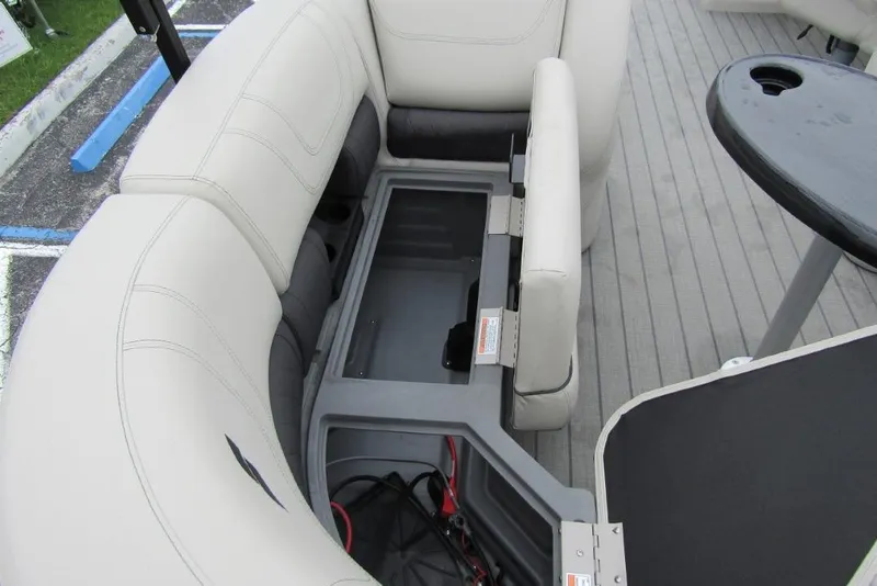Slide: The Image of 2022 Starcraft SLS 5 boat interior with open storage compartment and seating. - 20