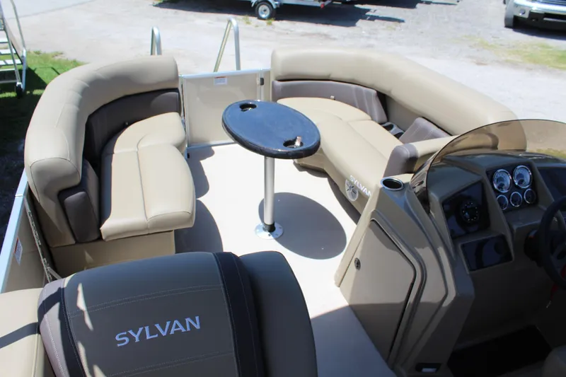 Slide: The Image of Interior of 2026 Sylvan Mirage 820 PARTY FISH boat with beige seating and table. - 10