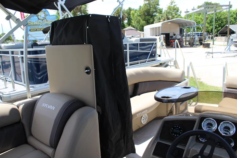 Slide: The Image of 2026 Sylvan Mirage 820 PARTY FISH pontoon boat interior with seating and dashboard. - 13