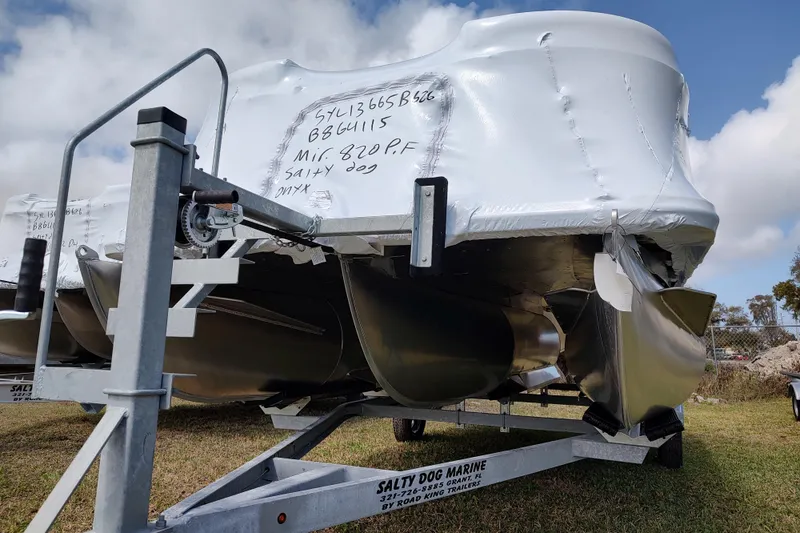 Slide: The Image of 2026 Sylvan Mirage 820 PARTY FISH boat on trailer, wrapped for transport. - 15