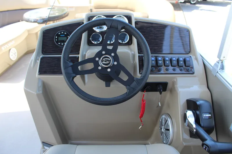 Slide: The Image of Steering console of 2026 Sylvan Mirage 820 PARTY FISH boat with modern controls. - 2