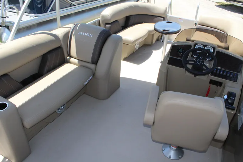 Slide: The Image of 2026 Sylvan Mirage 820 PARTY FISH interior with seating and helm. - 6