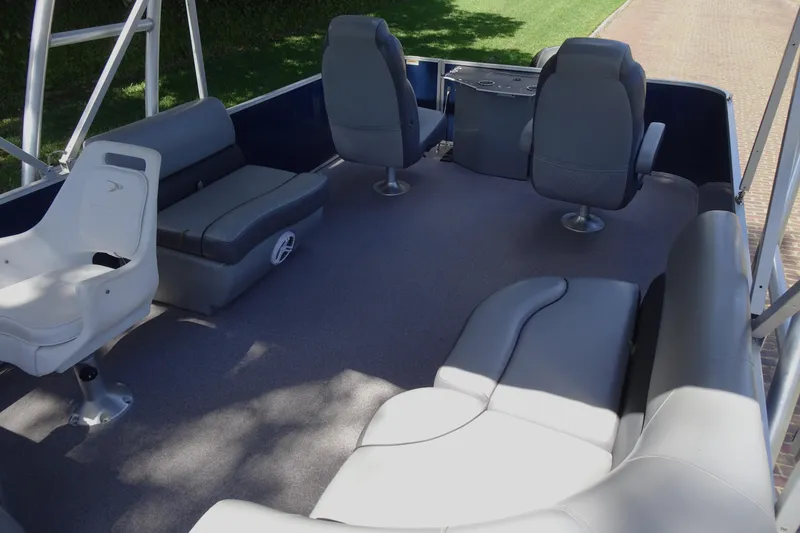 Slide: The Image of 2018 Veranda VF22TT pontoon boat interior with gray seating and spacious layout. - 13