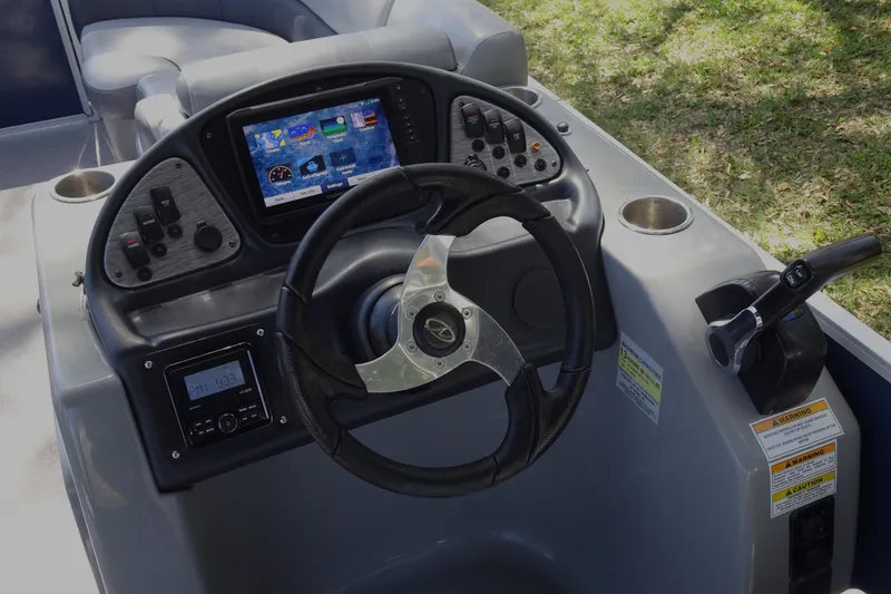 Slide: The Image of Cockpit of 2018 Veranda VF22TT boat with steering wheel and control panel. - 14