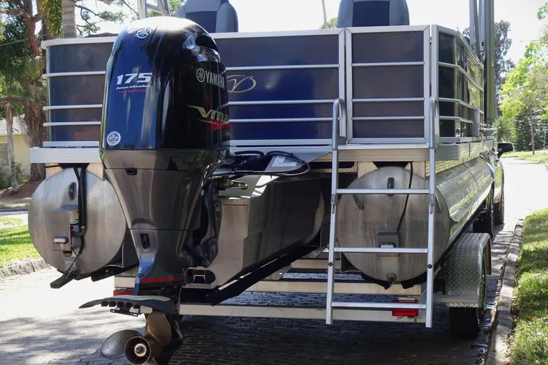 Slide: The Image of 2018 Veranda VF22TT pontoon boat with Yamaha 175 outboard motor, parked on a sunny street. - 4