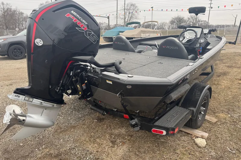 Slide: The Image of 2021 Vexus AVX 1880 boat with Mercury Pro XS engine, parked outdoors. - 3