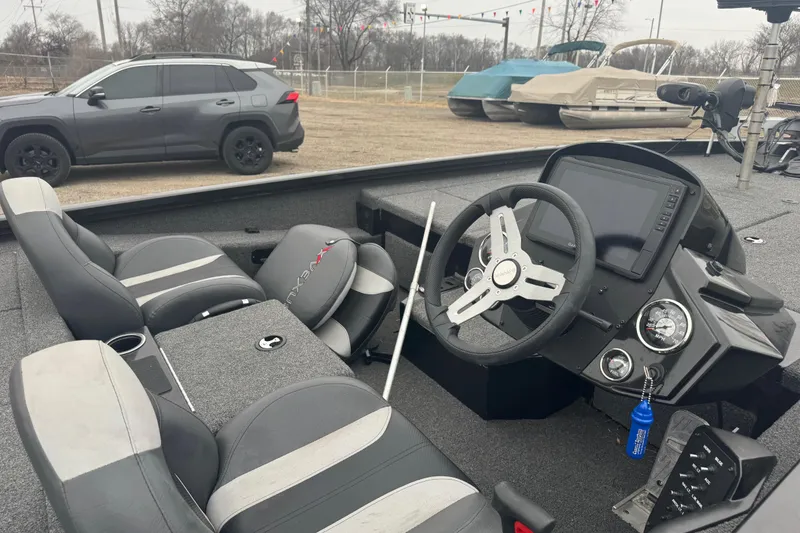 Slide: The Image of 2021 Vexus AVX 1880 boat interior with steering wheel and dashboard controls. - 4