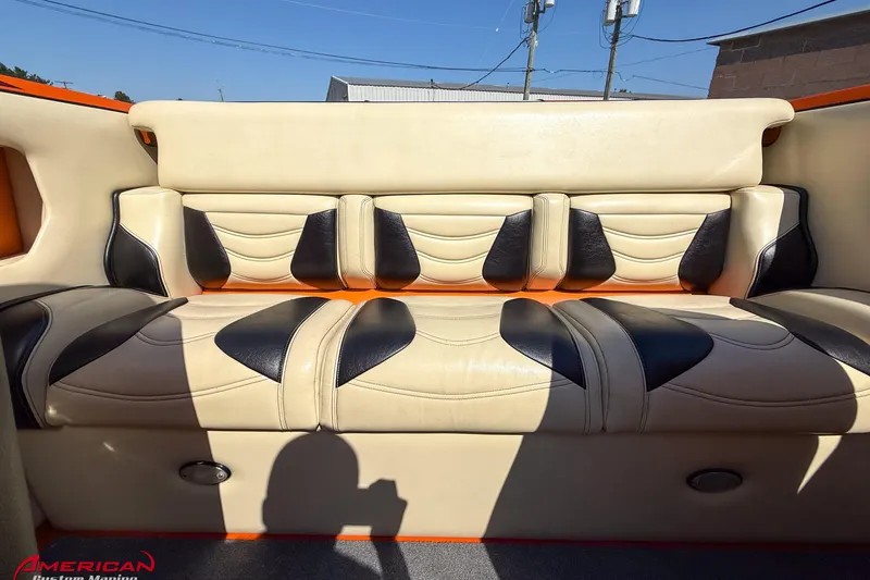 Slide: The Image of 2012 DCB 28 Extreme boat interior with beige and black leather seating. - 14