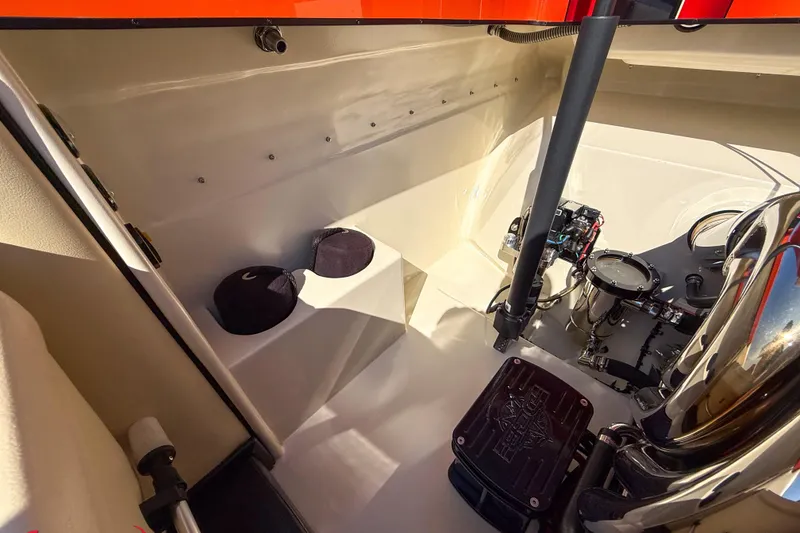 Slide: The Image of Interior view of 2012 DCB 28 Extreme boat engine compartment, showcasing mechanical components. - 19