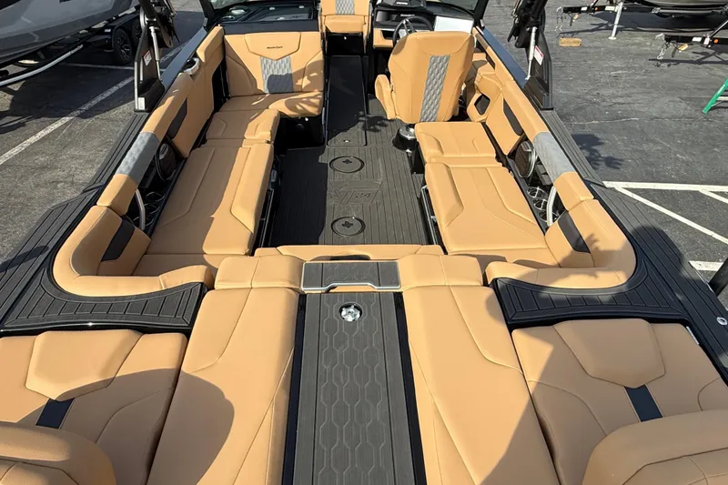 Slide: The Image of 2026 MasterCraft XT24 boat interior with tan seating and sleek design. - 4