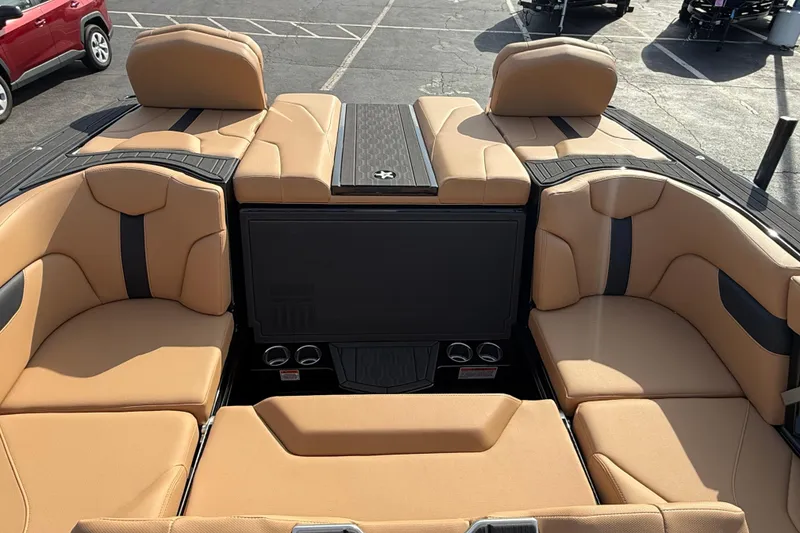 Slide: The Image of 2026 MasterCraft XT24 boat interior with tan leather seating and modern design. - 8