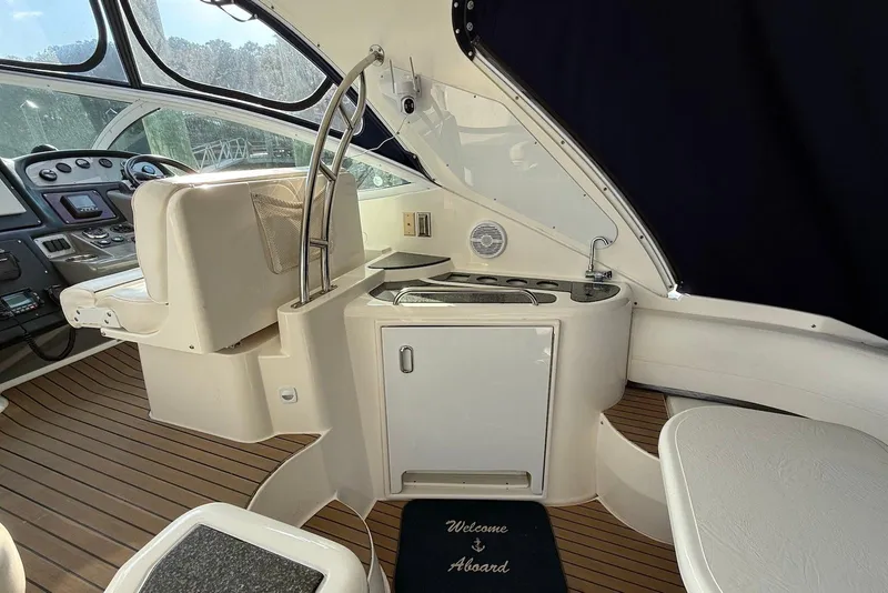 Slide: The Image of 2007 Cruisers Yachts 420 Express interior with panoramic windows and elegant seating. - 10
