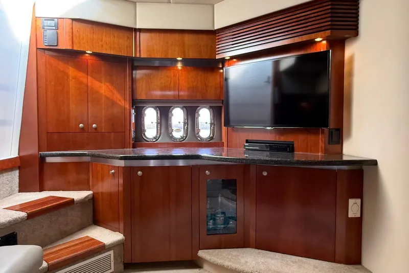 Slide: The Image of Luxurious interior of 2007 Cruisers Yachts 420 Express with leather seating and wooden accents. - 20