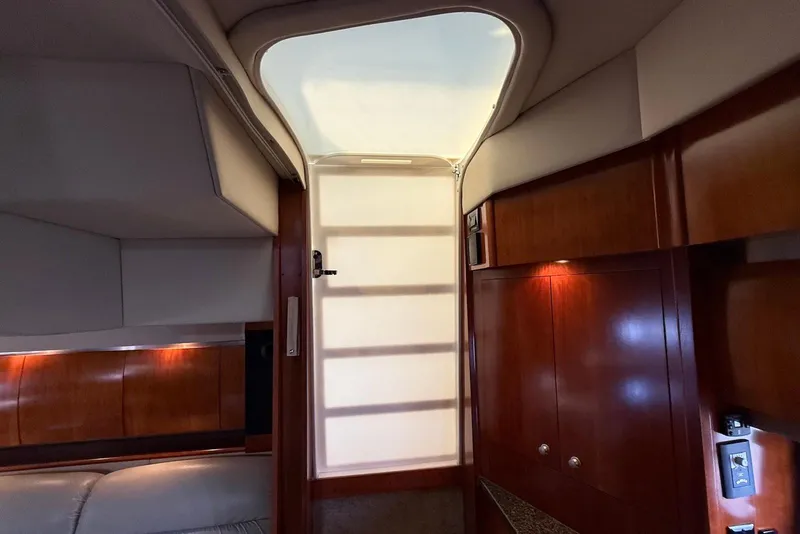 Slide: The Image of Luxurious interior of 2007 Cruisers Yachts 420 Express with wood cabinetry and modern amenities. - 23