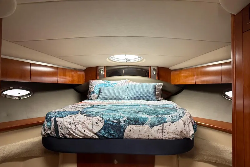 Slide: The Image of 2007 Cruisers Yachts 420 Express kitchen with wood cabinetry and modern appliances. - 24