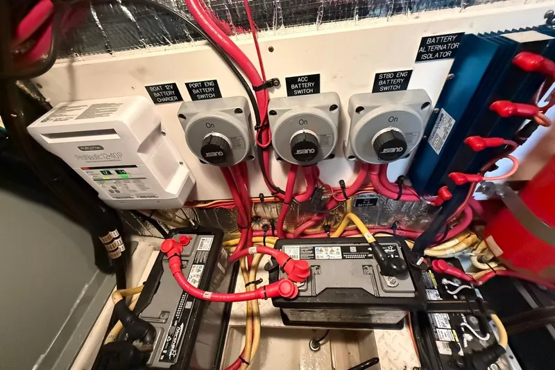 Slide: The Image of Macerator pump system in 2007 Cruisers Yachts 420 Express, featuring white hoses and fittings. - 32