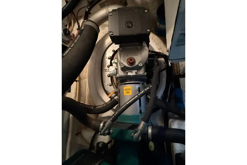 Slide: The Image of Engine compartment of 2007 Cruisers Yachts 420 Express, featuring marine exhaust system. - 39