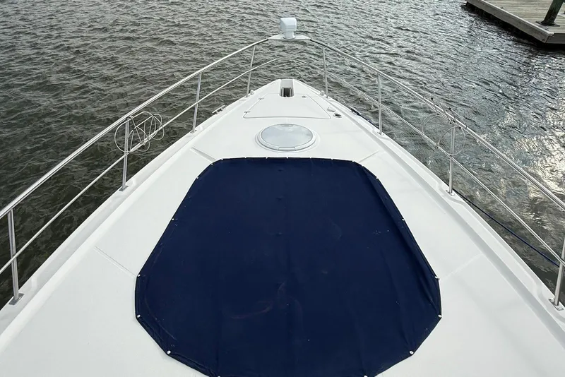 Slide: The Image of 2007 Cruisers Yachts 420 Express docked on calm water. - 4